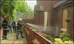 Fire services attend a petrol bomb attack on Short Strand houses