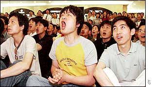 Chinese fans watch the Costa Rica game in a mall