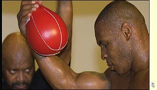 Stacey McKinley supervises Tyson's training