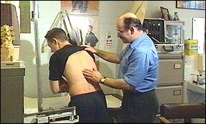 GP checking patient