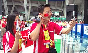 A football fan tries out one of KT ICOM's 3G phones in South Korea