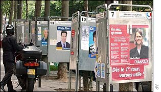 Election posters line a Paris street