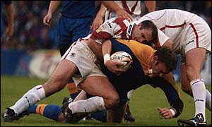 St Helens Paul Wellens comes up against the Leeds Rhinos defence