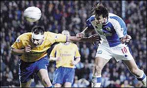 Matt Jansen (right) powers in header against Chelsea during April 2002