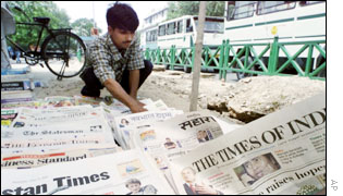 A New Delhi vendor arranges his papers