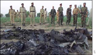Pakistani troops next to spy plane wreckage