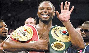 Lennox Lewis poses with his belts after beating Mike Tyson