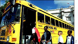 Pupils board First yellow school bus