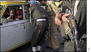 Police check a car