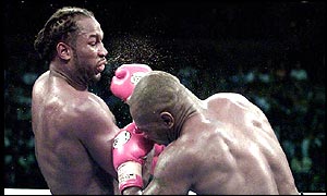 Lennox Lewis goes on the attack against Mike Tyson