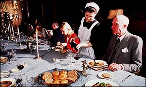 Sir John Leslie (r) eats at the castle