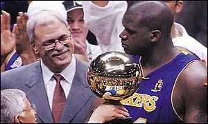 Phil Jackson (left) and Shaquille O'Neal get their hands on the NBA trophy once again
