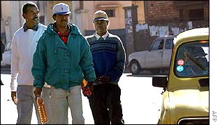 Antananarivo residents carrying petrol in bottles 