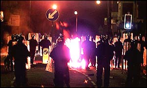 Police during the race riots that took place in northern England last year