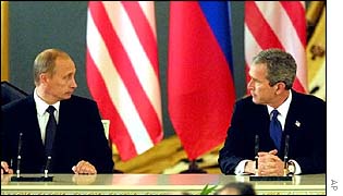 Russian President Vladimir Putin (left) and George Bush cancel the ABM Treaty