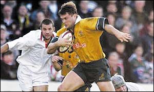 Ben Tune in action for Australia against an England Divisional XV