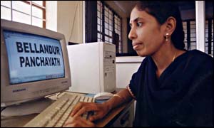 A programme operator with one of the village's three computers