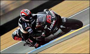 Italy's Loris Capirossi is on provisional pole in Barcelona