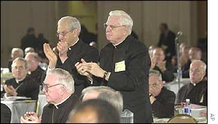 Cardinal Anthony Bevilacqua, left, and Cardinal Bernard Law lead the standing ovation