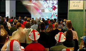 Fans watching a match in a pub