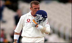 Alec Stewart kisses his helmet