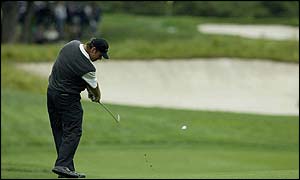Nick Faldo hits out of the fourth fairway