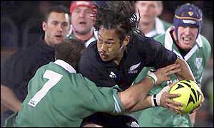New Zealand's Tana Umaga is tackled by Ireland's Keith Gleeson in Saturday's first Test