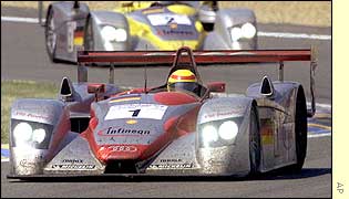 The triumphant Audi car, driven by Emanuele Pirro, Tom Kristensen and Franck Biela