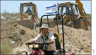 Security guard with bulldozers starting work on the fence