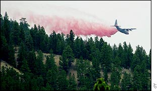 A helicopter drops retardant over the Hayman fire in Pike National Forest