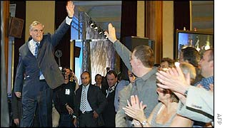 Jean-Pierre Raffarin greets supporters after news of the landslide win