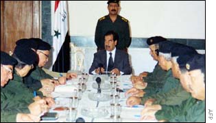 President Saddam Hussein (C) chairing a cabinet meeting in Baghdad