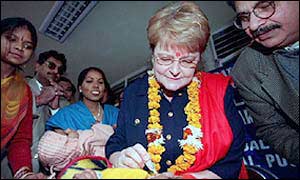 WHO chief Gro Harlem Bruntland immunising a child in India