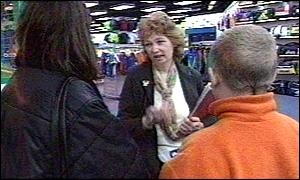 parent and child being stopped in shopping centre