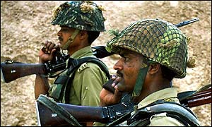 Indian soldiers patrol border