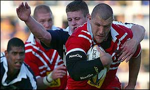 Barrie McDermott is tackled by Lee Radford