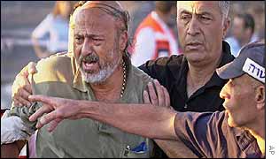 A man is helped to leave from the scene 