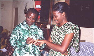 Johnnie places the ring on Michele's finger