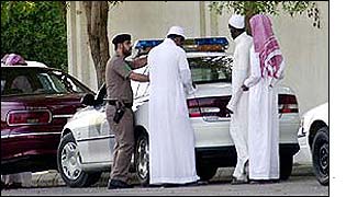 Saudi police question unidentified men at the site of the blast which killed Simon Veness