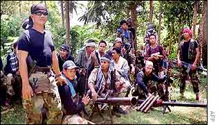 Abu Sabaya (left) with some of his men  