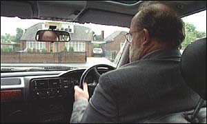 Older man driving car