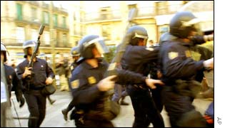 Police move in on anti-globalisation protesters in Barcelona