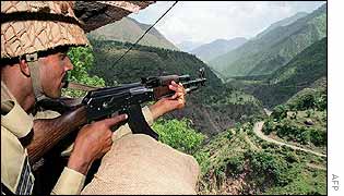 Pakistani soldier watches Line of Control