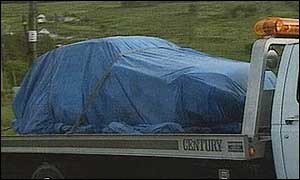 Rally car involved in accident being taken away by Irish police