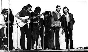 Ian Anderson on stage at Glastonbury 1970, with other performers including Al Stewart