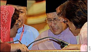 Mahathir Mohamad is consoled by party officials