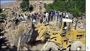 Bulldozer in Abdareh village, destroyed by quake