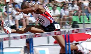 Colin Jackson flies over a hurdle on his way to victory