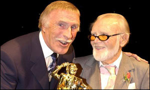 Bruce Forsyth accepts his award from Sir John Mills
