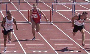 Colin Jackson (left) speeds to victory at the Parc des Sports stadium in Annecy, France